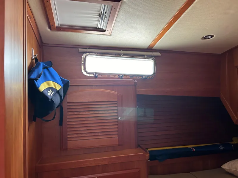 Slide: The Image of Interior of 2009 Sabre Hardtop Express with wooden paneling and porthole window. - 28