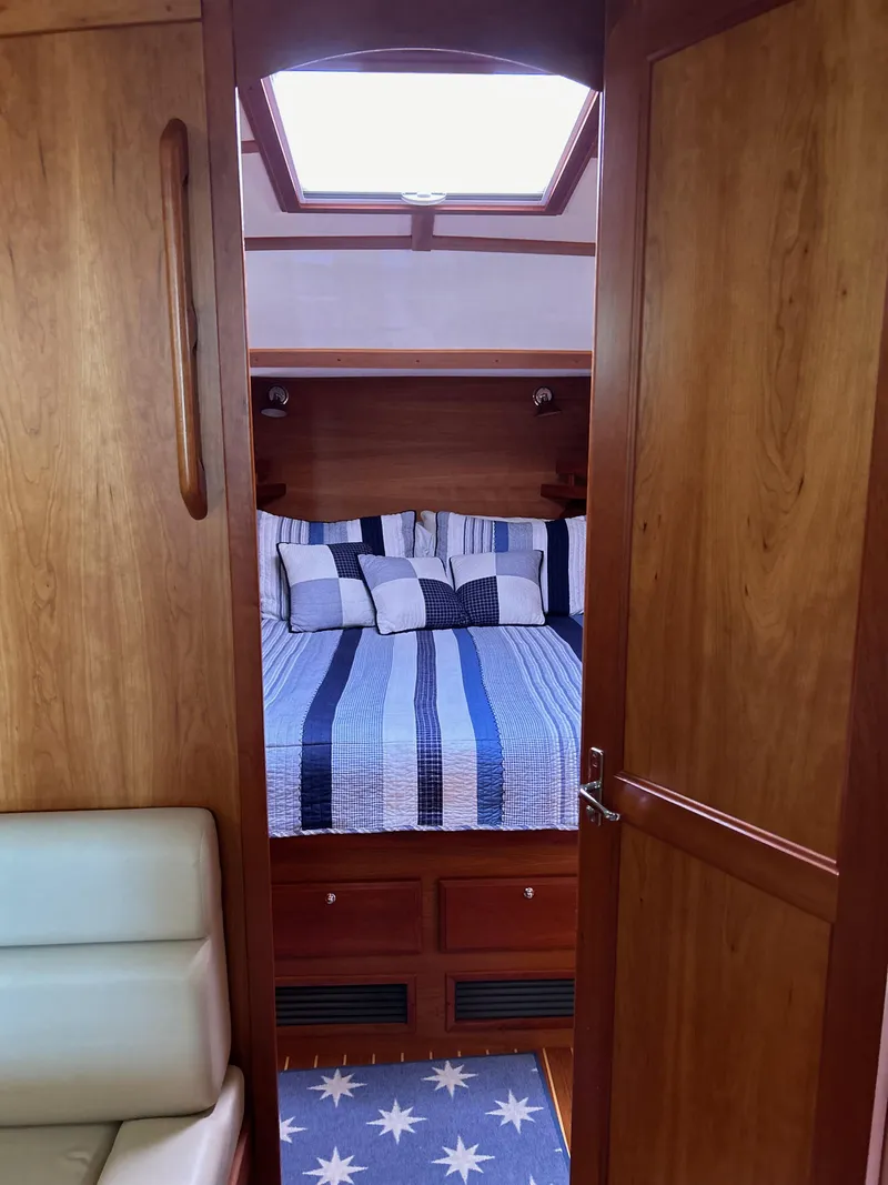Slide: The Image of Interior cabin of 2009 Sabre Hardtop Express with cozy bed and wooden finish. - 30
