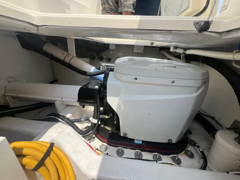 Slide: The Image of Engine compartment of 2009 Sabre Hardtop Express with visible mechanical components. - 38