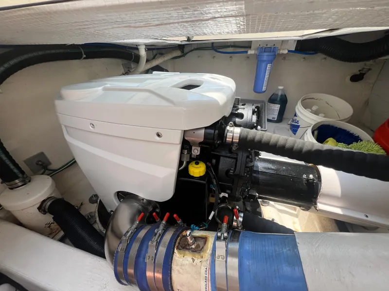 Slide: The Image of Engine compartment of 2009 Sabre Hardtop Express boat, showcasing mechanical components. - 39