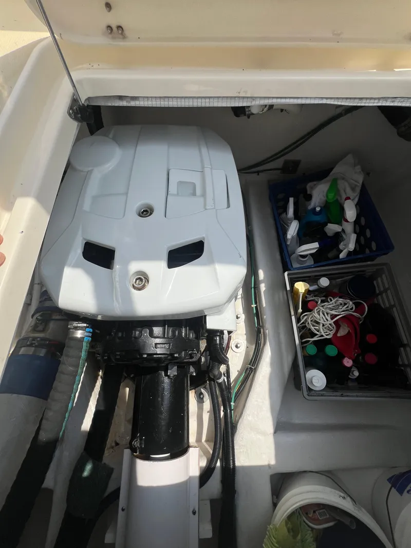 Slide: The Image of 2009 Sabre Hardtop Express engine compartment with organized storage bins. - 41