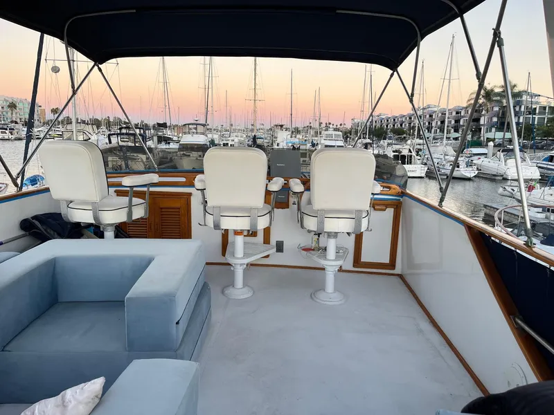 Slide: The Image of 1978 Marine Trader 44 Aft Cabin yacht interior with marina view at sunset. - 5