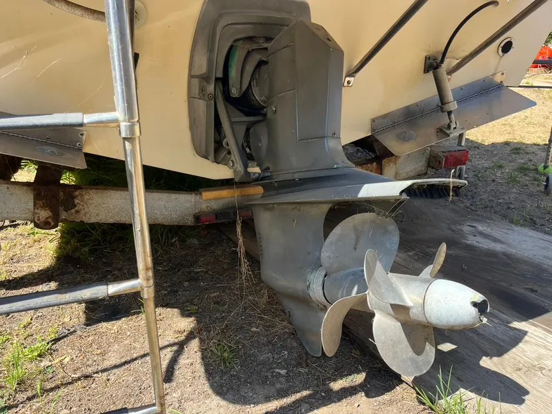 Slide: The Image of 1994 Parker 2520 boat propeller and stern drive on a trailer. - 23