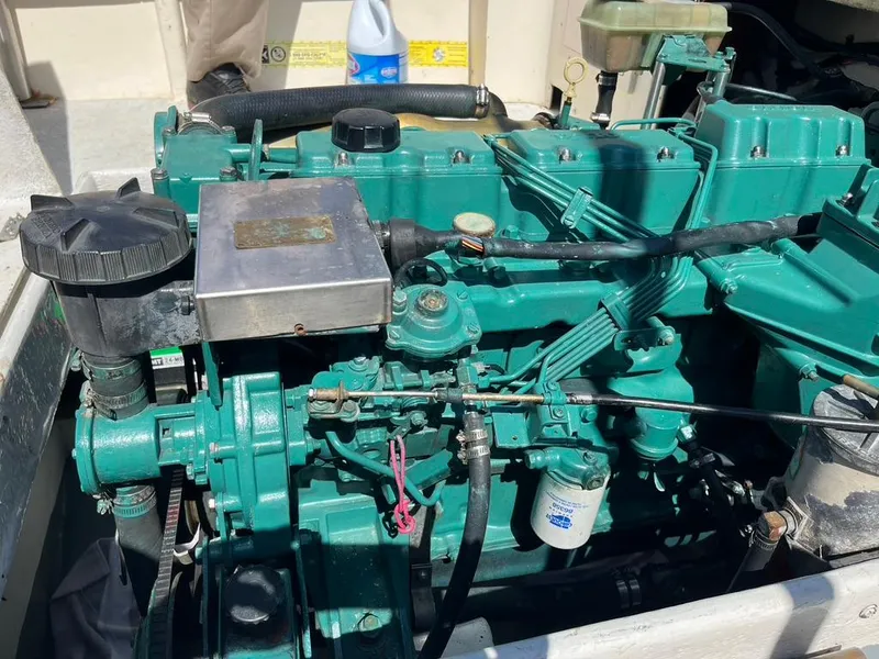 Slide: The Image of Engine of a 1994 Parker 2520 boat, showcasing detailed mechanical components. - 24