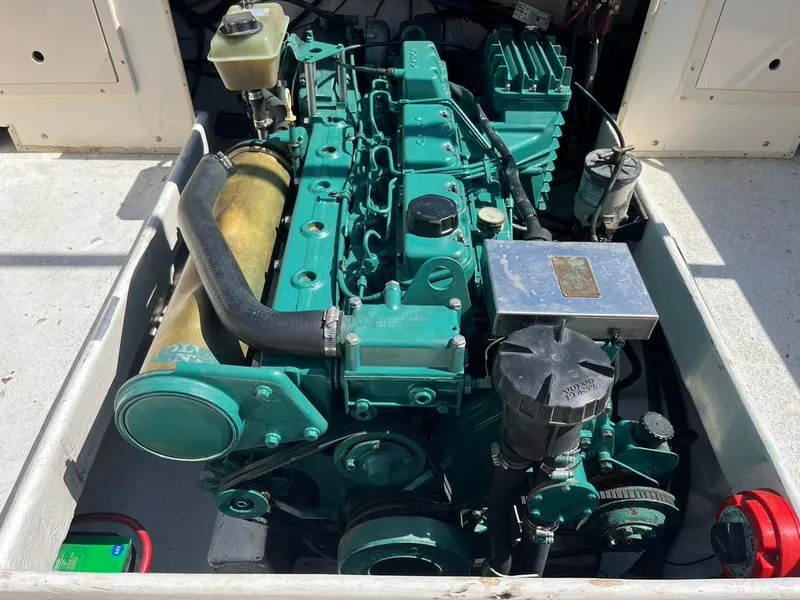 Slide: The Image of Engine of a 1994 Parker 2520 boat, showcasing detailed mechanical components. - 25