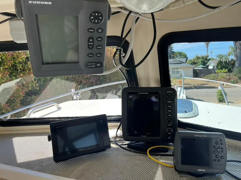 Slide: The Image of Navigation equipment inside a 1994 Parker 2520 boat cabin. - 29