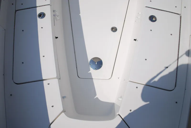 Slide: The Image of 2021 Regulator 31 boat interior with white seating and console. - 19