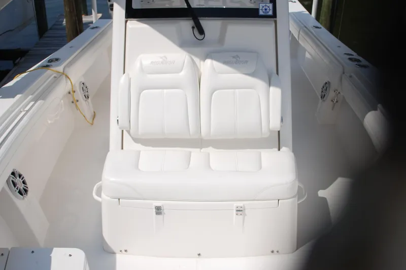 Slide: The Image of 2021 Regulator 31 boat interior with white seating and console. - 28