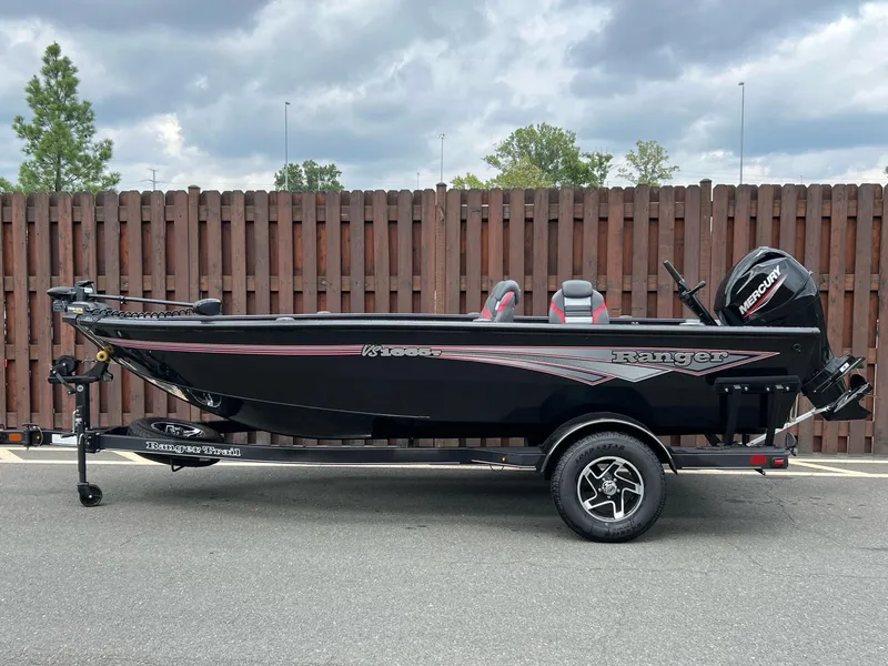 The Image of 2024 Ranger VS1665T boat on trailer, black exterior, parked outdoors. - 0