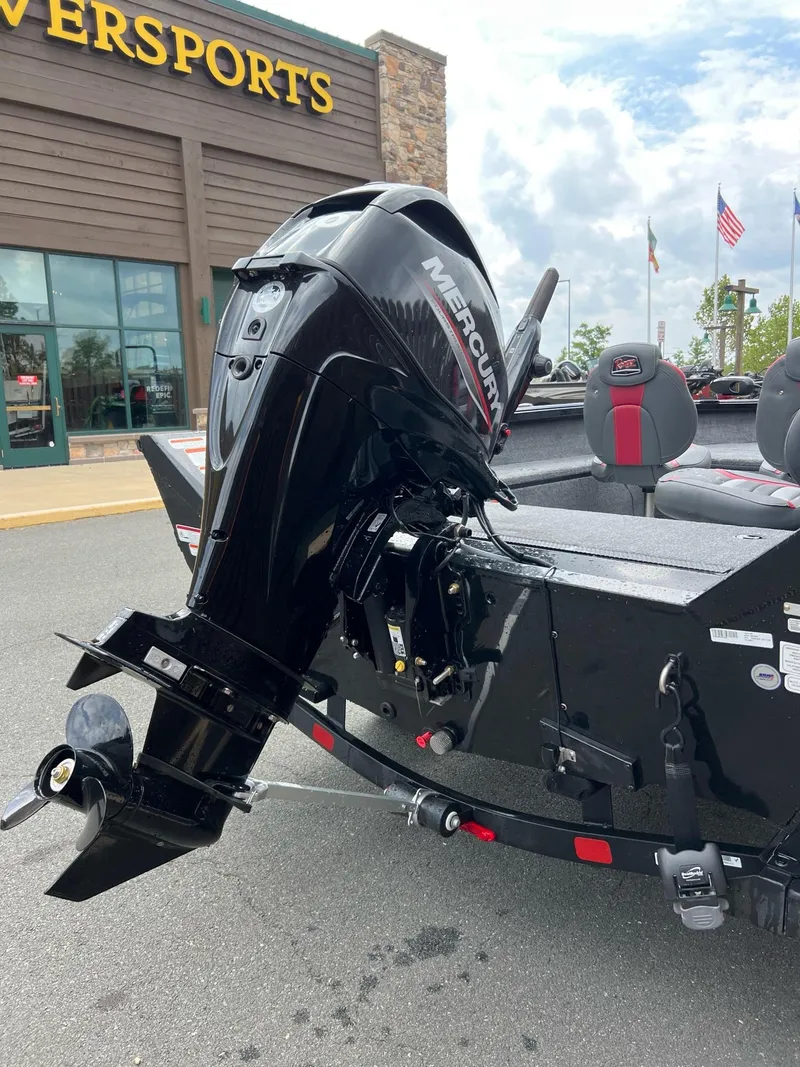 Slide: The Image of 2024 Ranger VS1665T boat with Mercury outboard motor, parked outside a dealership. - 3