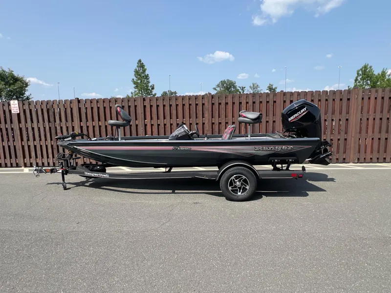 The Image of 2024 Ranger RT188C boat on trailer, parked outdoors, side view. - 0