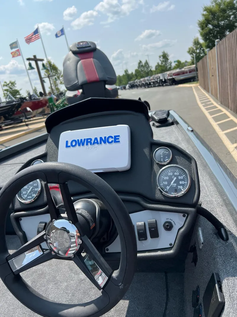 Slide: The Image of 2024 Ranger RT188C boat dashboard with Lowrance display and steering wheel. - 4