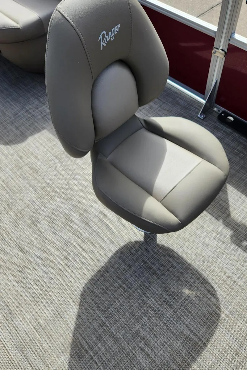 Slide: The Image of 2024 Ranger Reata 200F boat seat with gray upholstery and logo. - 10