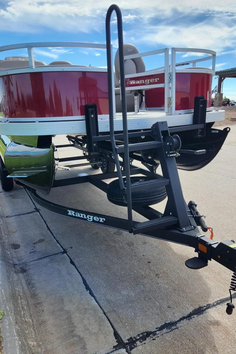 Slide: The Image of 2024 Ranger Reata 200F boat on trailer, red and white design. - 5