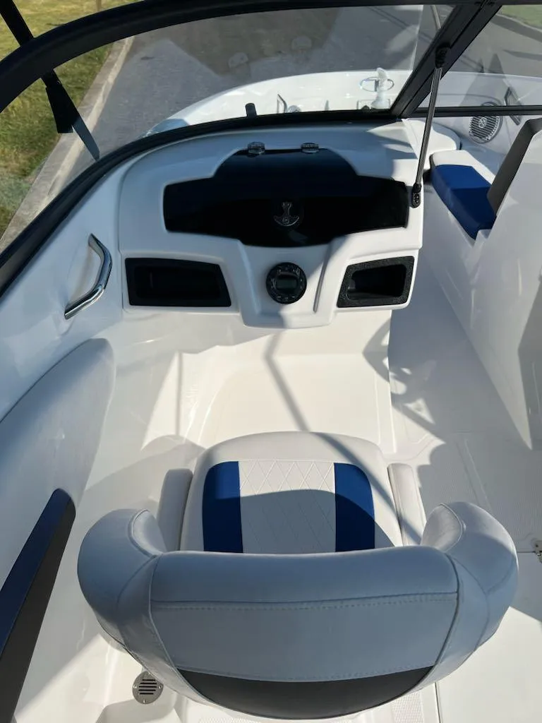 Slide: The Image of 2024 Tahoe 200 S boat interior with modern dashboard and seating. - 7
