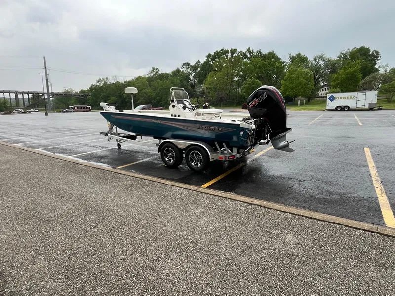 Slide: The Image of 2024 Ranger RB200 boat on trailer in parking lot, overcast day. - 3