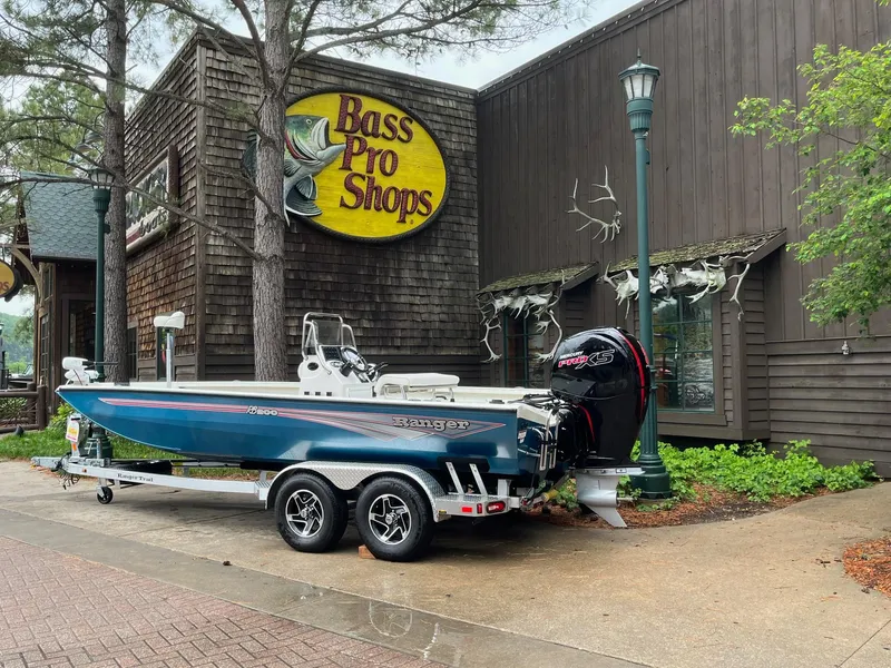 Slide: The Image of 2024 Ranger RB200 boat parked outside Bass Pro Shops store. - 4