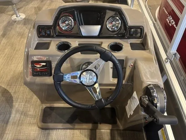Slide: The Image of 2024 Ranger Reata 200F boat dashboard with steering wheel and gauges. - 5