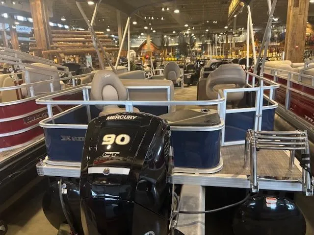 Slide: The Image of 2024 Ranger Reata 200F pontoon boat with Mercury 90 CT engine in showroom. - 6