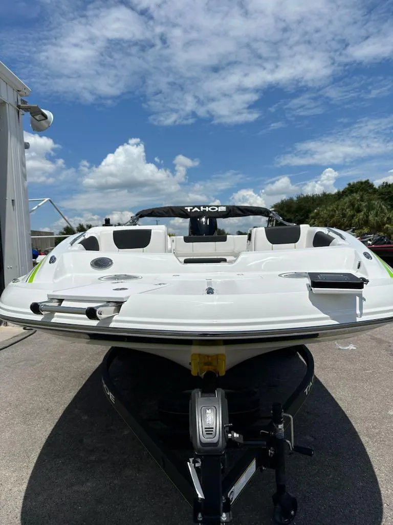 Slide: The Image of 2024 Tahoe 1950 boat on trailer under blue sky. - 3