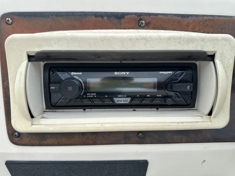 Slide: The Image of Sony stereo system in a 1999 Suncruiser Trinidad 200 boat dashboard. - 5