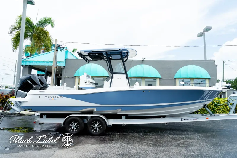 The Image of 2025 Caymas 281 HB boat on trailer, displayed outdoors at Black Label Marine Group. - 1