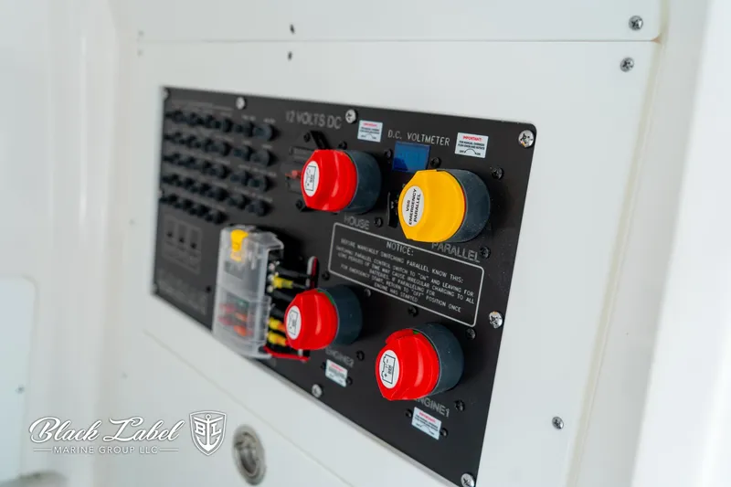 Slide: The Image of Control panel of 2025 Caymas 281 HB boat with labeled switches and dials. - 12