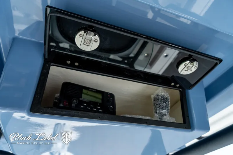 Slide: The Image of Storage compartment in 2025 Caymas 281 HB boat with electronic equipment. - 18