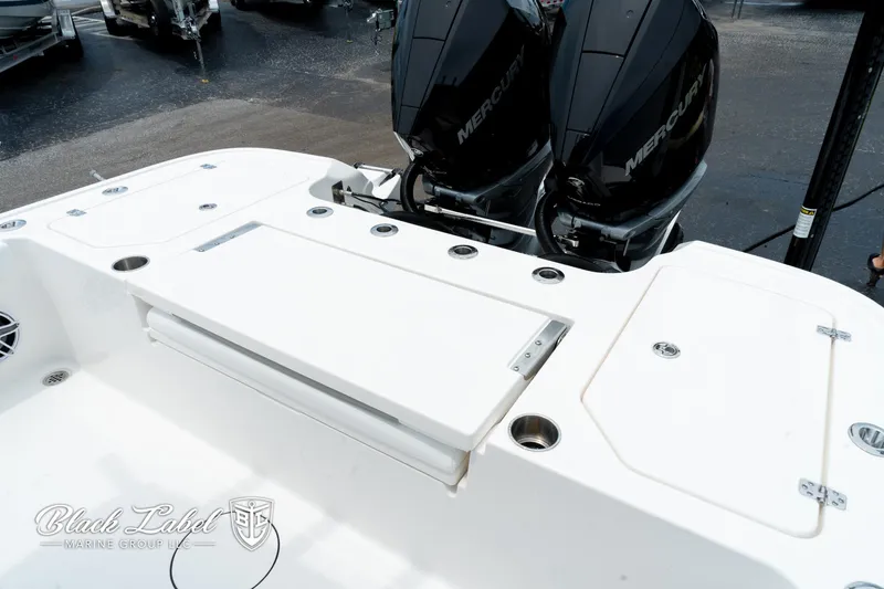 Slide: The Image of 2025 Caymas 281 HB boat with dual Mercury engines, featuring a spacious deck layout. - 25