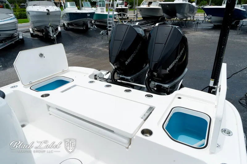 Slide: The Image of 2025 Caymas 281 HB boat with dual Mercury engines, featuring storage compartments and sleek design. - 27