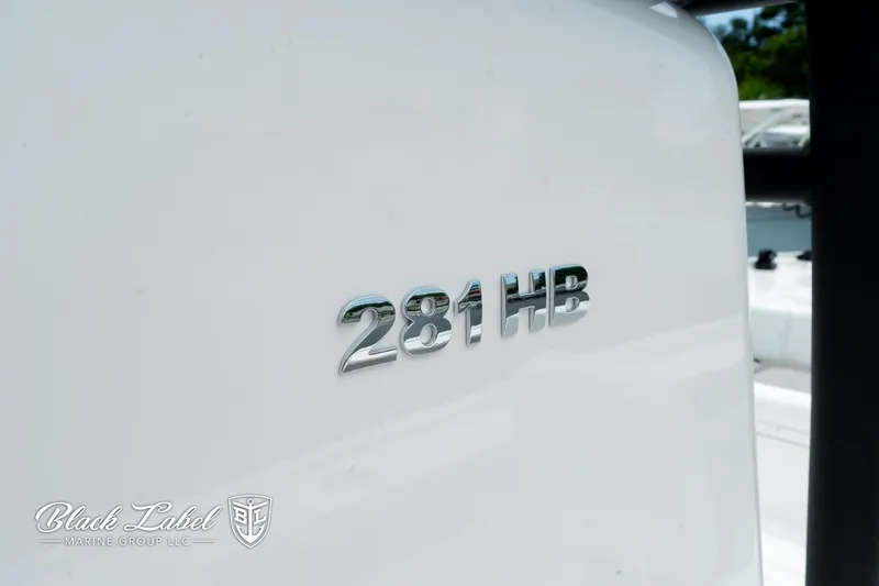 Slide: The Image of 2025 Caymas 281 HB boat logo on white surface, Black Label Marine Group branding. - 31