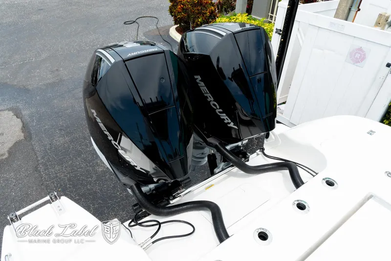 Slide: The Image of 2025 Caymas 281 HB boat with dual Mercury outboard engines. - 33