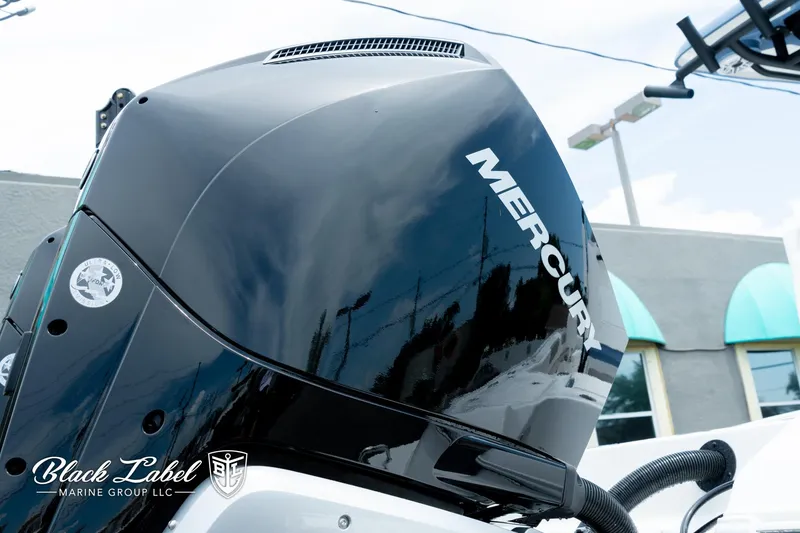 Slide: The Image of 2025 Caymas 281 HB with Mercury engine, Black Label Marine Group branding. - 35