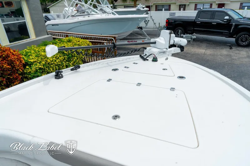 Slide: The Image of 2025 Caymas 281 HB boat deck with trolling motor, displayed at Black Label Marine Group. - 4