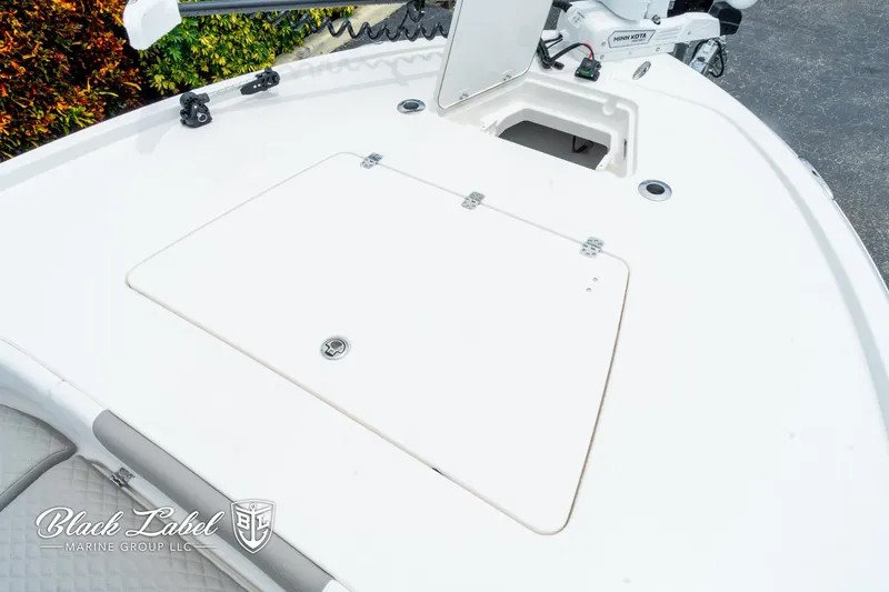 Slide: The Image of 2025 Caymas 281 HB boat deck with storage compartment and trolling motor. - 7