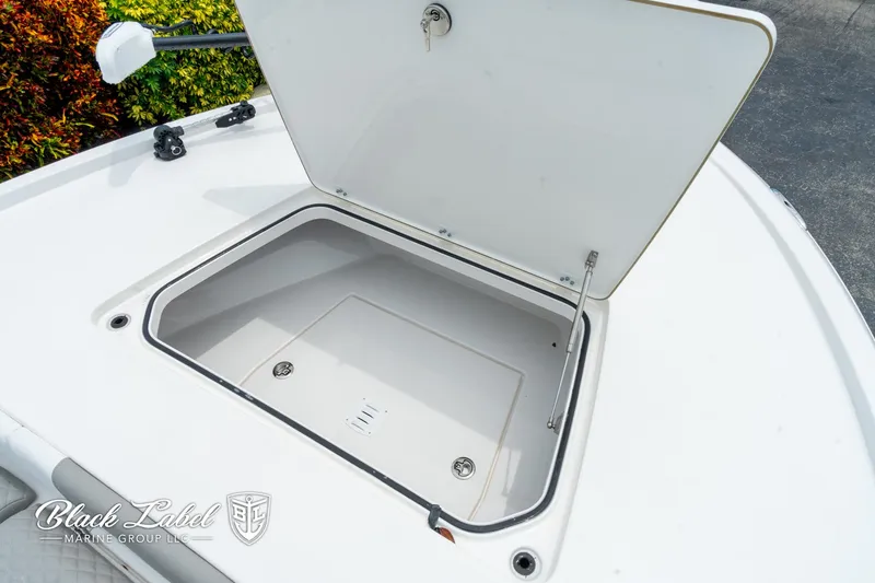 Slide: The Image of Open storage compartment on 2025 Caymas 281 HB boat deck. - 8