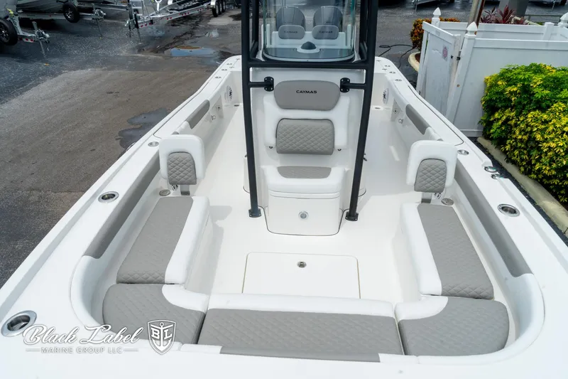 Slide: The Image of 2025 Caymas 281 HB boat interior with cushioned seating and sleek design. - 9