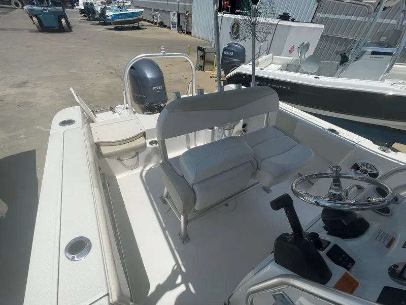 Slide: The Image of 2016 Robalo R200 Center Console boat interior with seating and steering wheel. - 12