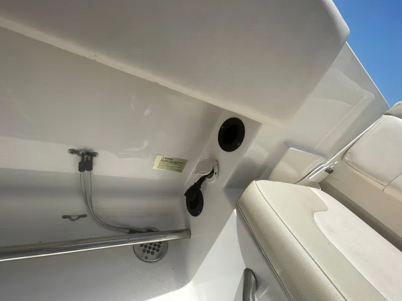 Slide: The Image of 2016 Robalo R200 Center Console interior detail with seating and fixtures. - 16