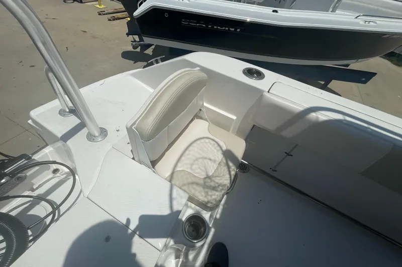 Slide: The Image of 2016 Robalo R200 Center Console boat interior with seating and cup holders. - 22