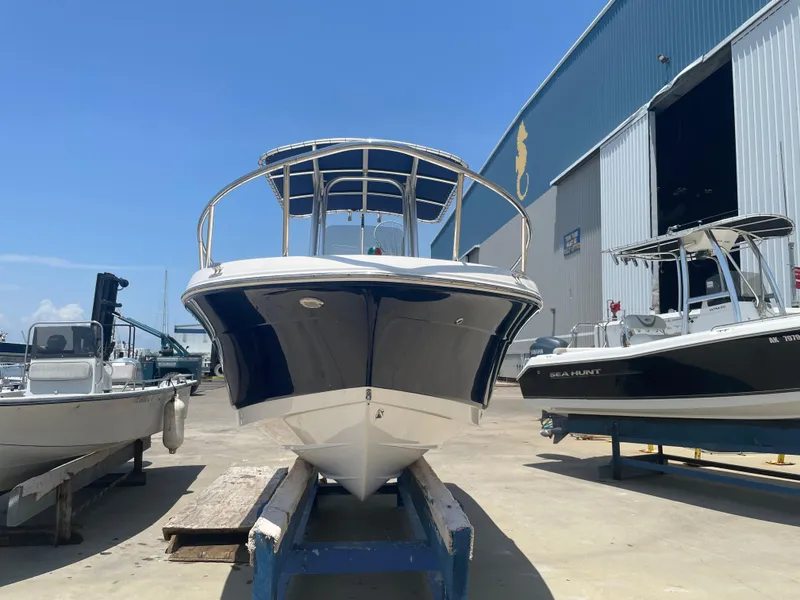 Slide: The Image of 2016 Robalo R200 Center Console boat in a marina, front view. - 3