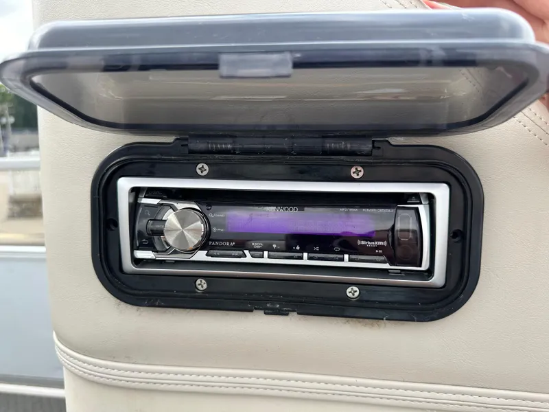 Slide: The Image of 1990 Crest III stereo system with protective cover, featuring a digital display and control knob. - 13