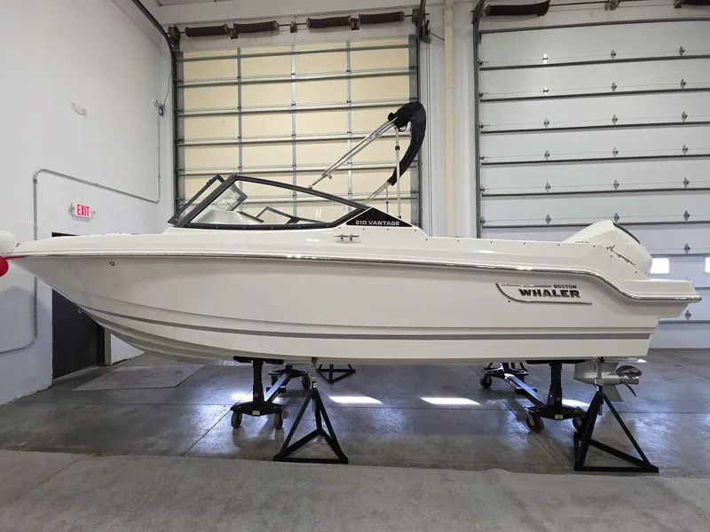 The Image of 2025 Boston Whaler 210 Vantage boat displayed indoors on stands. - 0