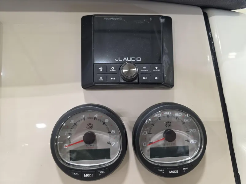 Slide: The Image of Dashboard of 2025 Boston Whaler 210 Vantage with JL Audio system and gauges. - 19