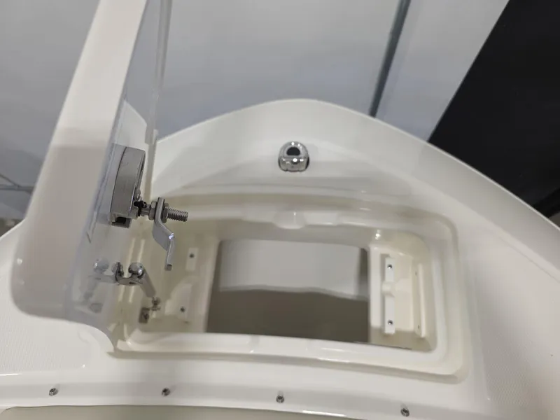 Slide: The Image of Open storage compartment on a 2025 Boston Whaler 210 Vantage boat. - 20