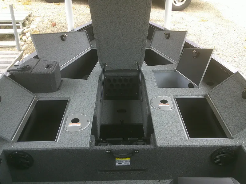 Slide: The Image of 2024 Lund 2075 Pro Guide boat interior with multiple storage compartments. - 10