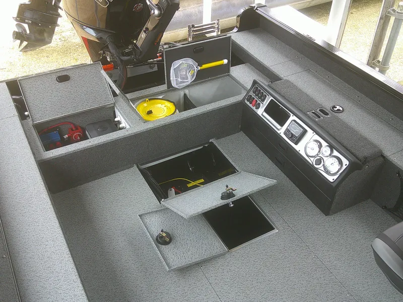 Slide: The Image of 2024 Lund 2075 Pro Guide boat interior with storage compartments and control panel. - 6