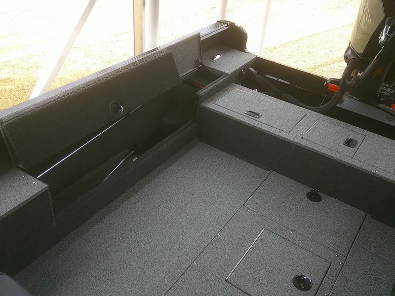 Slide: The Image of 2024 Lund 2075 Pro Guide boat interior with storage compartments. - 7