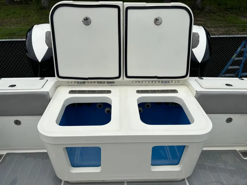 Slide: The Image of 2017 HCB Speciale boat on a lift, outdoors under a cloudy sky. - 13