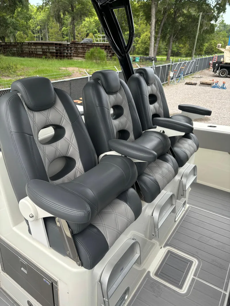 Slide: The Image of 2017 HCB Speciale boat with open storage compartment and dual outboard motors. - 20